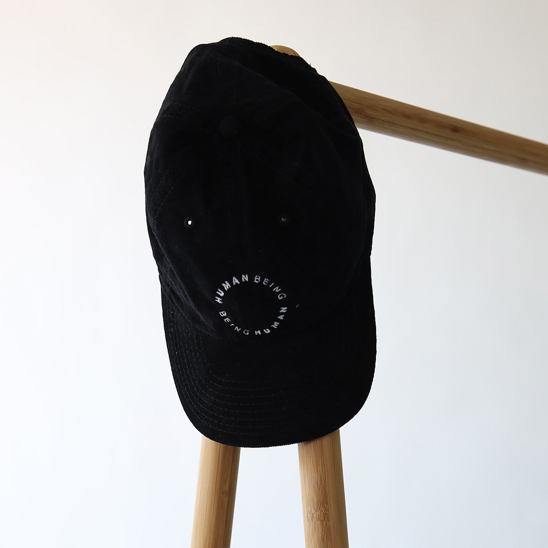 Cap: HUMAN BEING BEING HUMAN (Sort)